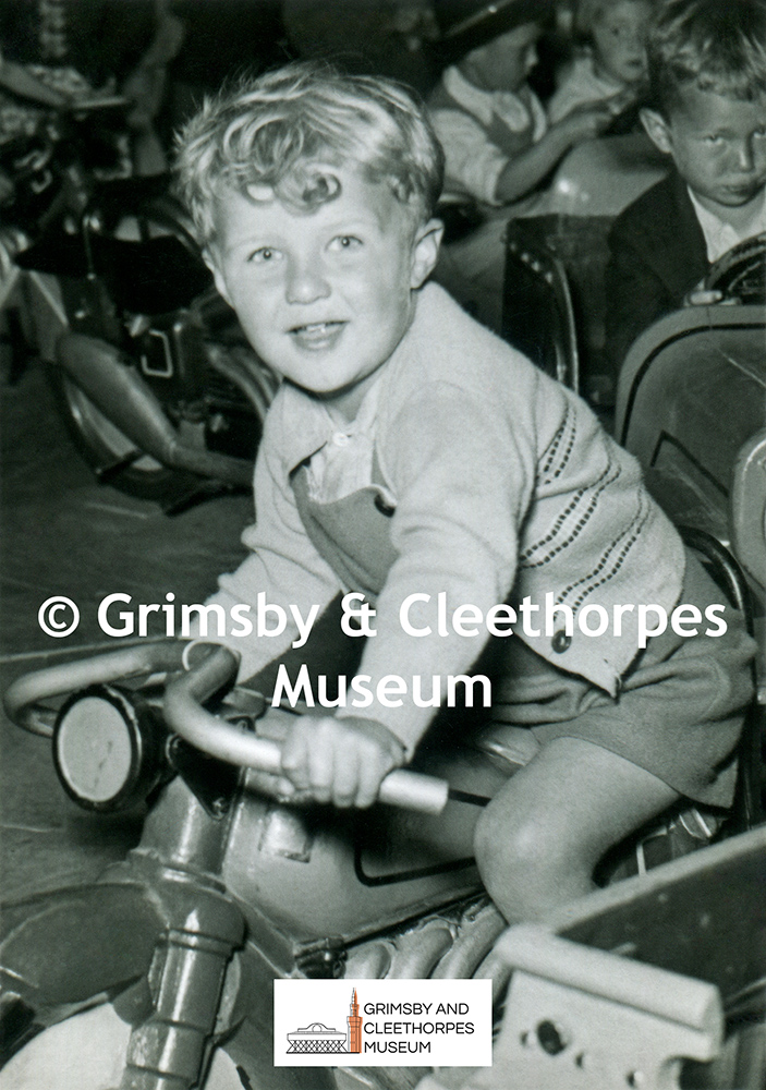 Wonderland Amusements, Cleethorpes; boy on motorbike 1950