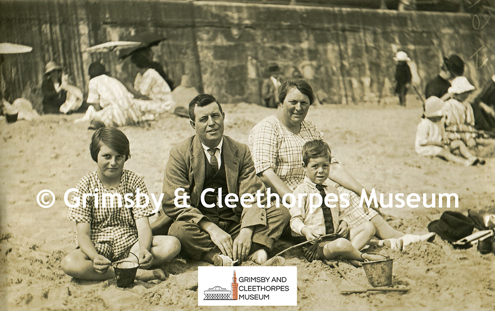 A family of four on Cleethorpes beach by Hardy c1920s