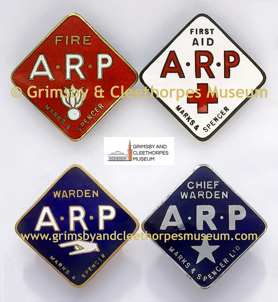 A set of four Marks & Spencer ARP warden badges c1939